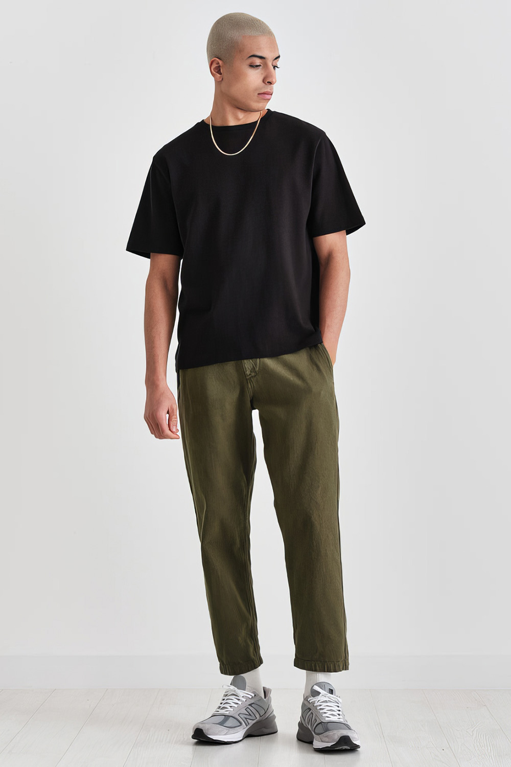 Men's green and black outfit combination