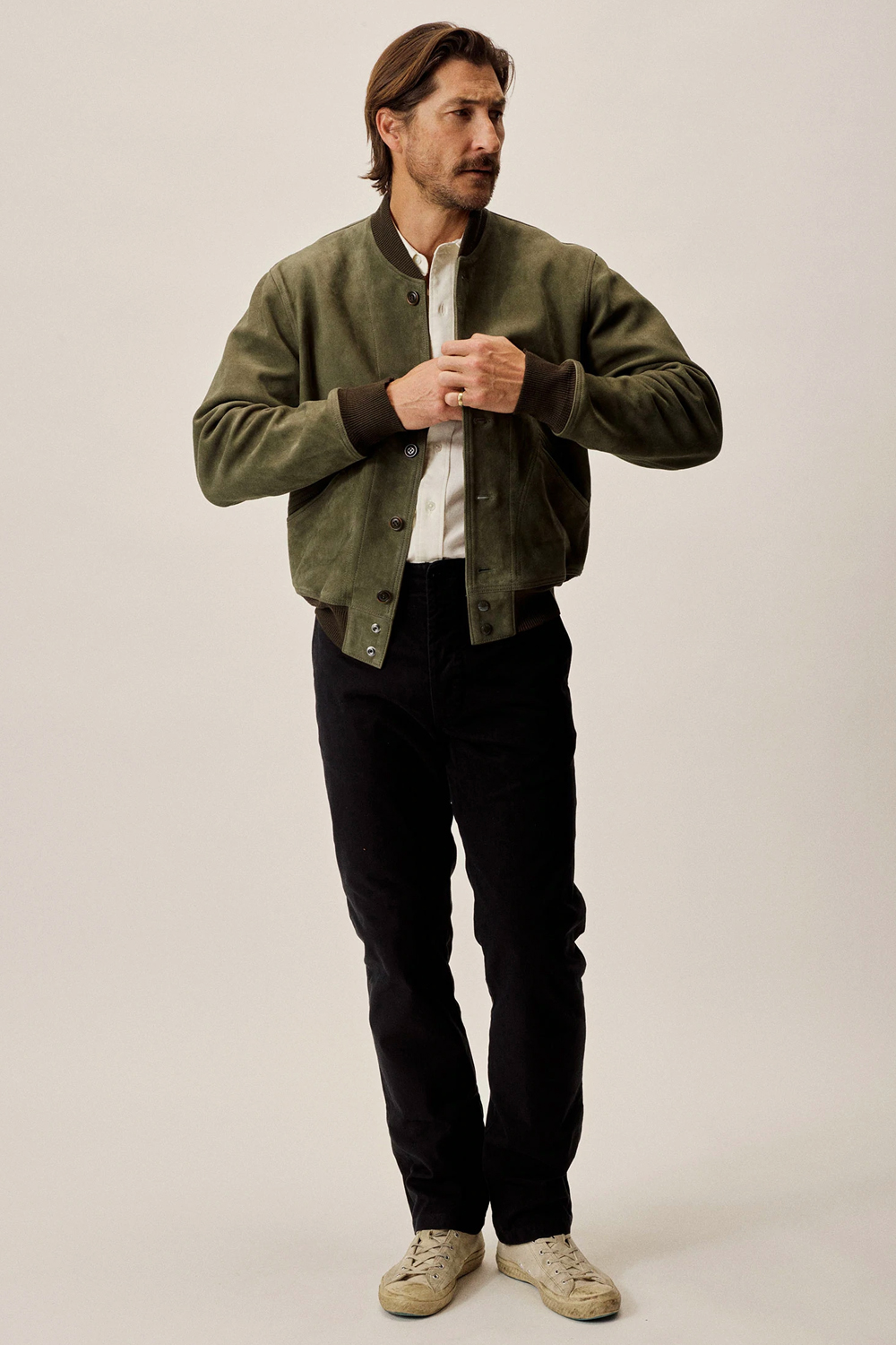 Men's green and black outfit combination