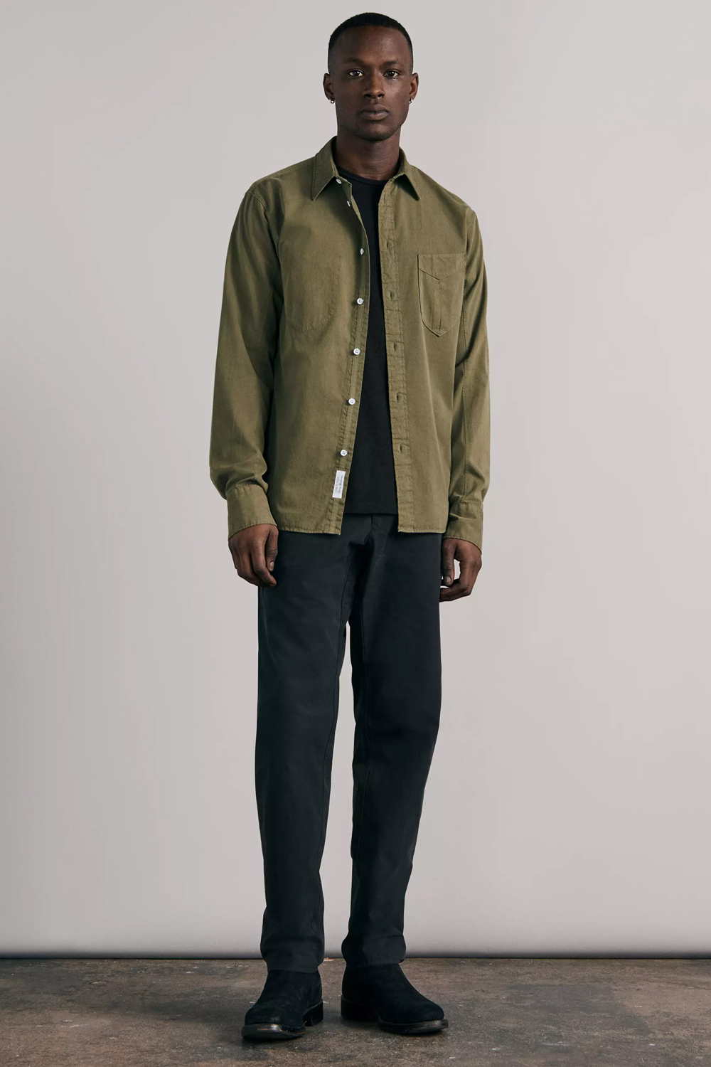 Men's green and black outfit combination